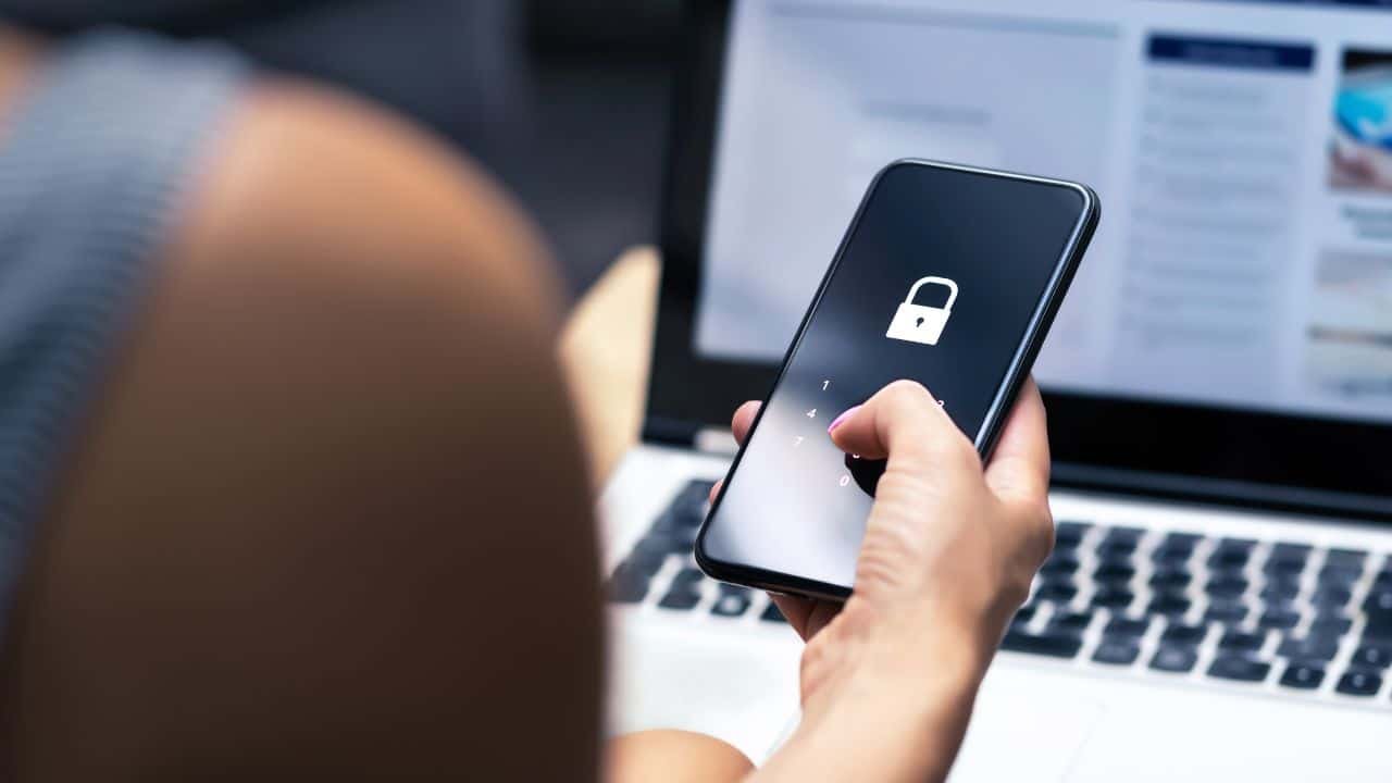 Illustration of a person being targeted by various mobile scams on their phone.